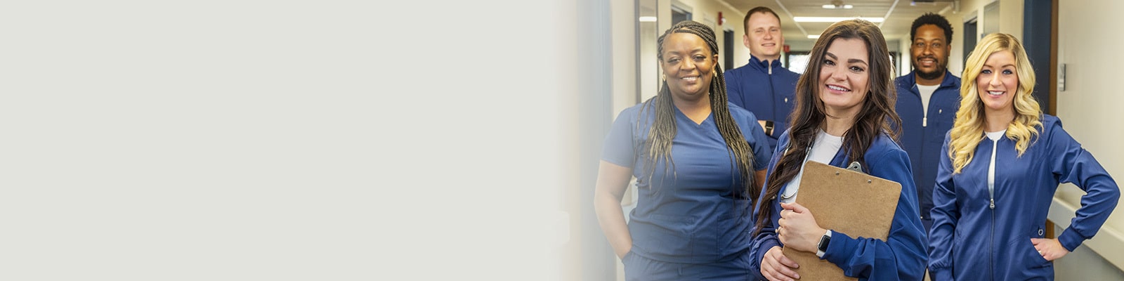 Group of nurses standing in a hallway