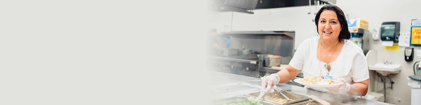 a chef in the kitchen at Del Rosa Villa Nursing Center
